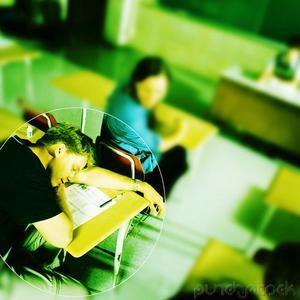 Classroom sleep - A student sleeping on the drawing board in classroom.