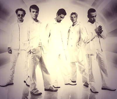 Pop singers in uniform - Backstreet boys artists are in white suit.