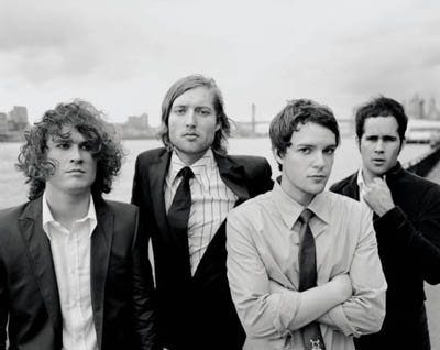 The Killers - Early B&W photo of the killers posed lead singer Brandon is crossed armed front and center
