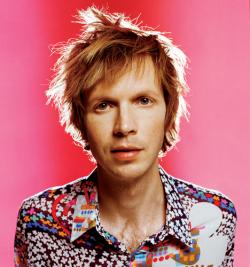 Beck - Beck w/ wild hair against a pink backdrop
