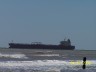 Ship in the Gulf - We were enjoying a day at the beach in Surfside, TX. when we saw this huge ship on the horizon. We all thought it was magnificent.
