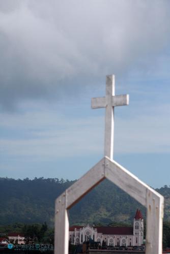 Baguio Cathedral - Framed with another church&#039;s cross. Baguio Cathedral has become the center of worship for catholics in the City for decades.