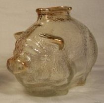 The piggy bank from my 3rd grade teacher - I didn’t miss any days of school during my 3rd grade year. I loved going to school because it was a lot nicer there than it was at home and I really did like Miss Revett. And on the last day of school, Miss Revett gave me a little glass piggy bank with a shiny dime in it! I really loved that little glass pig and kept it for many years until one day it fell and broke.