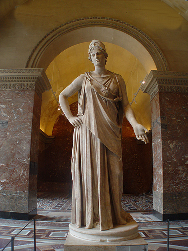 Who is the statue depicting? - I took this photo at the Louvre, all the while I thought it to be Apollo but seem to be wrong...anyone knows who he actually is? Thanks!