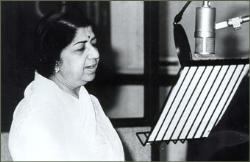 Lata Mangeshkar - Melody Queen Of India - This is a photo of Lata in a recording studio. Lata Mangeshkar - Melody Queen Of India - This is a photo of Lata in a recording studio.