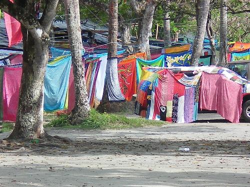 Sarong Sea At the Sarong Market, Manuel Antonio, C - This is a market place in Manuel Antonio, Costa Rica, where thousands of Sarongs are hung, blowing in the sea breeze, it is a beautiful picturesque scene.