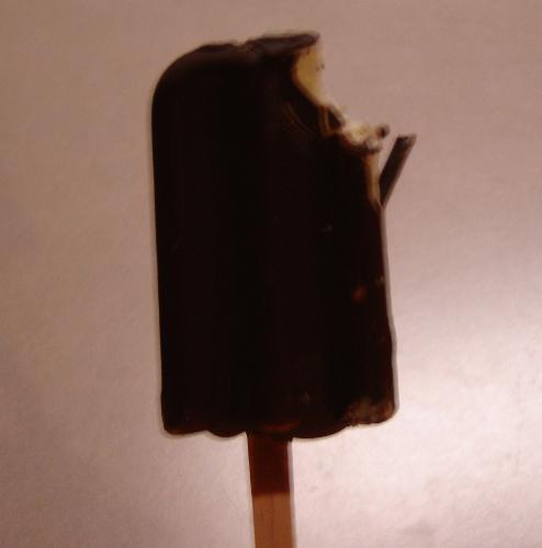 ice cream bar - this is a photo of an ice cream bar with a bite taken out of it.