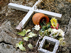 messy cemetary plot - This Grave is littered with dead flowers and Garbage! What Purpose does this mess serve?