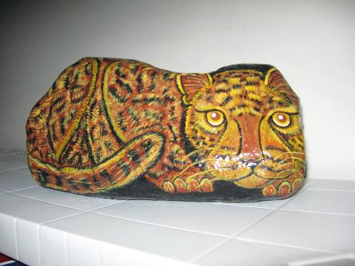Leopard in Stone - This 'Leopard in Stone' is a rock painting done by Lucienne Guinette and was given to me as a parting gift by two of the service techs I had worked with for many years. The guys said the leopard was most representative of our working relationship ... we all got alone great ... but when we bumped heads ... things could get nasty.  I will miss those guys.