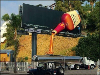 Billboard Creativity - A billboard ad for a drink. Its 3d and looks like liquid is really pouring out of the bottle on the billboard.. 