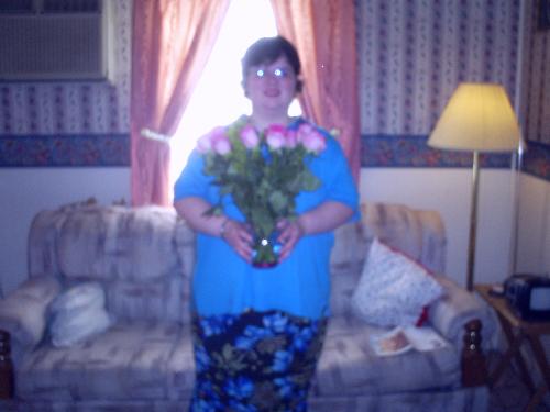 Amanda with her flowers - This is the picture I took of Amanda holding the pink roses (one dozen!!!!) that Mark gave her Saturday. They are absolutely gorgeous!!! Amanda with her flowers - This is the picture I took of Amanda holding the pink roses (one dozen!!!!) that Mark gave her Saturday. They are absolutely gorgeous!!!
