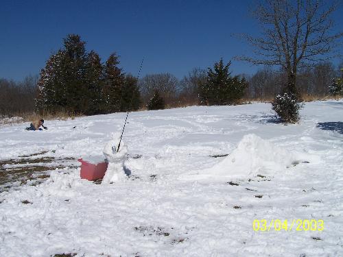 snow fisherman - Missing the warmth of the beach and fishing for the big one, My husband made a snow fisherman catching a marlin.