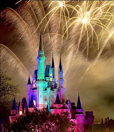Disney - The disney castles shrowded in fireworks.