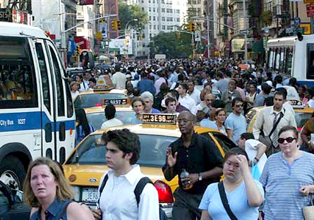 Busy City - A busy city, people walking around taxis in a traffic jam