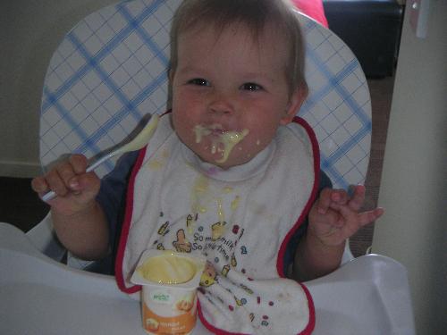 my son - joshua when he was 10months old eating custard. How cute.