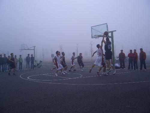 a basketball match on a foggy winter morning - our school team is having a basketball match with another team from a different school.