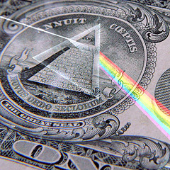 one-dollar bill pyramid - one-dollar bill pyramid close-up shot with a rainbow/color effect added in.