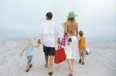 family having fun - a photo of a family on a beach having fun