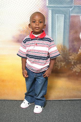 my grandson. - This is a photo of my one and only grandchild.His name is Trayvaughn and he's three years old.
