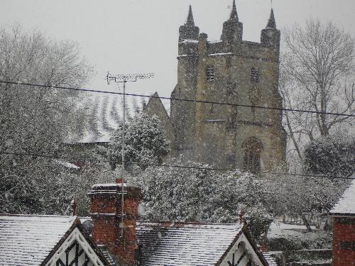 Snow Around the Church - A view of the snow, looking across to the Church, which is on a hill.. April 6th 2008