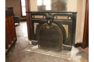 Fireplace - The house has two chimneys but this is the only fireplace that I know of. The house has been empty for a while so it's unknown if this can still be used. I don't intend on finding out until it's been professionally inspected and cleaned and that will probabl not happen any time soon.   I don't know where in the house it's located. One chimney appears to be in the location of the living room and the other is near the kitchen...but old houses can be deceiving with chimneys to second floor fireplaces and fireplaces with their chimneys torn down.
