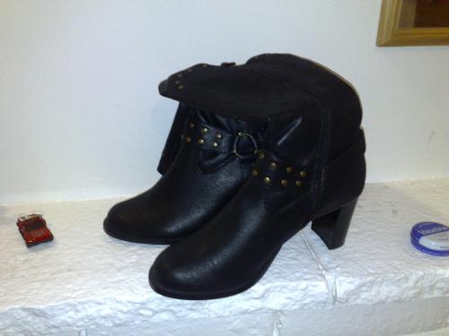 Boots - Puss in boots was one of my favorite childhood stories.   As children we used to dress up in our mother's high heels and model. The image we presented with our little feet in the big shoes reminds me of the story puss in boots.