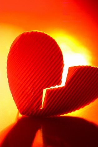 relationship - a broken heart that represents sadness and heart aches, pains