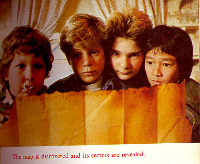 the goonies with the map - a photo of the cast of the goonies with the treasure map