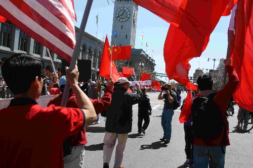 Show the world our solidarity behind the Beijing O - Chinese flags paint the san francisco red.