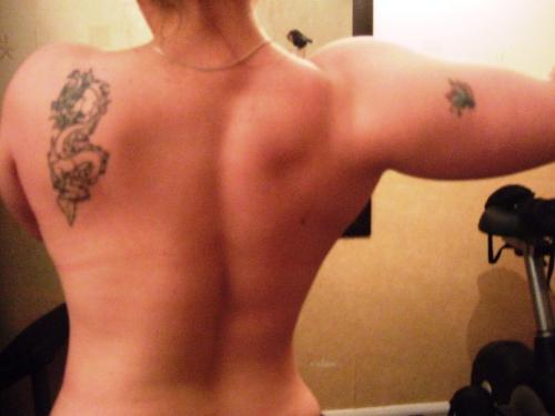 Working Out.. my back and shoulders - This is my back after a really productive Deltoid (shoulder) workout. There's no feeling like it, when you leave the gym feeling pumped, strong and muscular, after pumping some heavy iron for a while. Some people say its not feminine for a female to be muscular, but i really dont think the small amount of muscle i have so far affects my femininity at all.. in fact i feel 100% more confident with some muscle, than i did before i started training when i had none. I'd say to any girl interested in weight-training, or even amateur female bodybuilding.. Go For It!.. there's no reason at all why we girls cant train as well as the boyz.:) x