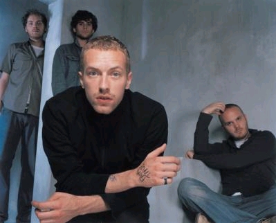 Coldplay - Chris in tilt CU band in BG light blue backdrop