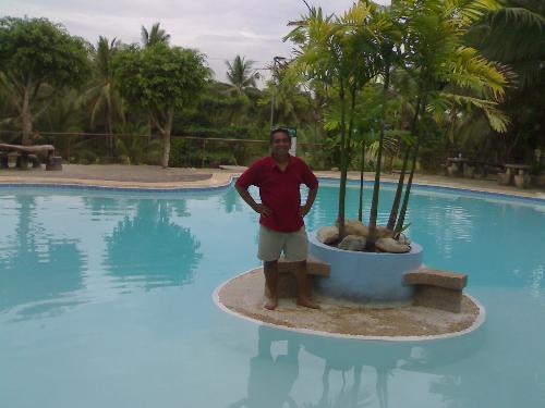 in the middle of swimming pool in the middle of a  - one of the pools in the hidden paradise mountain resort. thatz me.