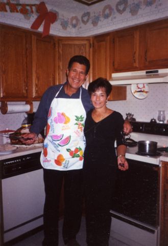 My Honey& me.... Thanksgiving Day 2000 - Eli& Celia ...That's me on the right. My Honey getting ready to carve the turkey. I like to think we have not changed all that much;-)