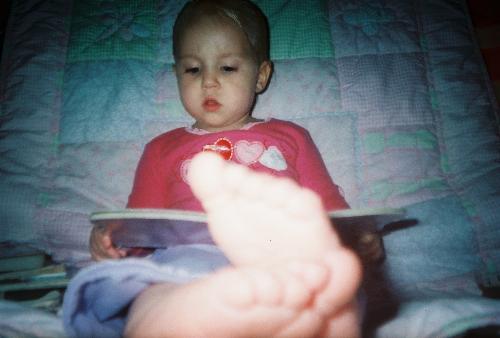 Kenzel Reading - Kenzel loves to sit and read her books. Here she is reading a bedtime story to Grandma