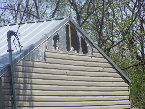 Damage to a neighbor's home - This is damage done to a neighbor's home after the storm in Muldrow, OK on 4/9/08.