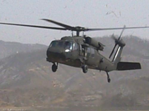 UH60, army helicopter  - This is a photo I took while I was in Korea. I was telling the pilot that he could land in our airspace. I am an air traffic controller. It is quite fun. I even gotten to ride in one. They are quite fun if the pilot knows how to do a few turn around tricks.