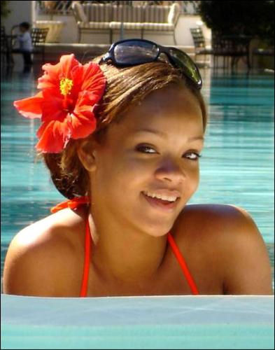 rihanna - rihanna with a flower