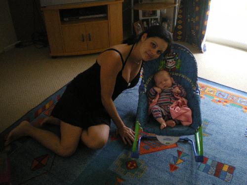 Shanae sitting in her rocker - I am beside her - Shanae and I at home - she is sitting in her rocker
