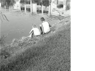Kids at the pond - My kids hanging out at the pond just sharing some time together.