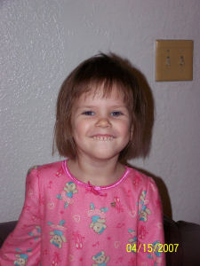 My 3 year old's haircut - This is the picture of her hair after I cut it. I ended up cutting about 4 inches in length off the back.