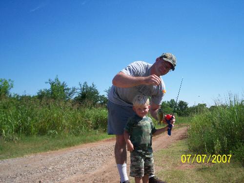 sons first fish - last summer,middle son got his first fish