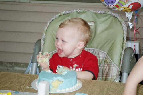 Grandson's First Birthday - Grandson digging into his birthday cake. Boy was that fun!