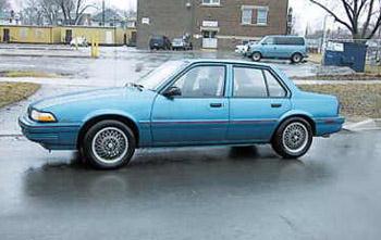 '94 Pontiac Sunbird - This is a picture of a blue four door 1994 Pontiac Sunbird car.