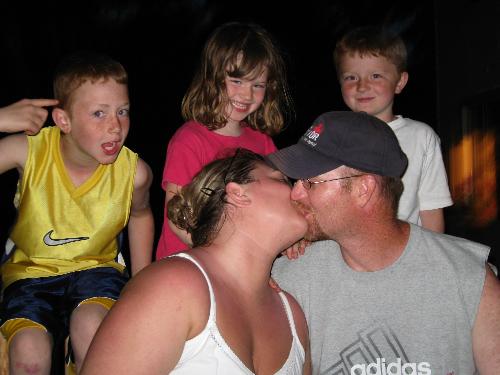 kissing - My kids freaked out when we kissed in front of them. Im glad they got it on camera. I will remind them when they get older how disgusted they were. haha 