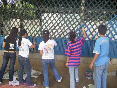 to the daycare center, with love - this is a picture of me and my groupmates painting the daycare center. we love the camera... hehe... but we love the kids who study there more =)