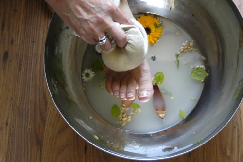 ayurveda gentle care - This lovely picture shows how we care for the client using ayurvedic herbs to cleanse and nurture the feet. This practice is done before we do marma point foot therapy. Marma points are not unsimilar to acutunture points on the body or feet. The differenec is in the oils and the way the foot in massaged, in reflexology there is often a tendency to put pressure on certain points - in ayurvedic foot marma therapy it is the gentle motion and specific movements that are diercetd towards the marma points on the feet. people say it is 'blissful' therapy.