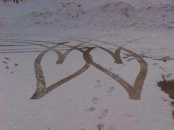 car tracks - Heart shaped car tracks in the snow.