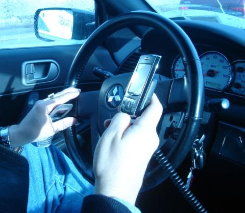 Crazy car dirver with two mobile phones - This one&#039;s from wikipedia