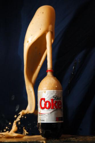 coke and mentos -  Coke and Mentos Eruption (also known as a Mentos eruption, soda geyser or just Coke and Mentos) is a reaction of soda and mentos. The most well-known example of this reaction (among many possibilities) is the specific combination of Mentos candy and Diet Coke, typically achieved by dropping several candies into a bottle of the cola. This results in a jet of cola from the mouth of the bottle due to the rapid expanding of the carbon dioxide on the surface of the candy. Producing the reaction has become a popular science experiment and an Internet meme, with videos of eruptions and even performance art pieces being posted on websites like YouTube and Google Video.