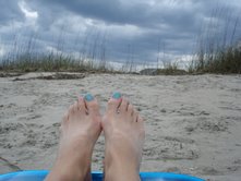 Beach - This is picture taken at Tybee Island in Georgia. I love how my toenails match the darkening sky and my beach chair. My friend took this photo. The two of us enjoyed our time together and goofed around taking pictures of each other.